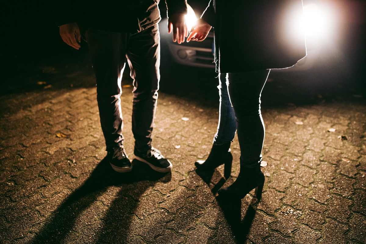 Couple says goodbye to each other in the night
