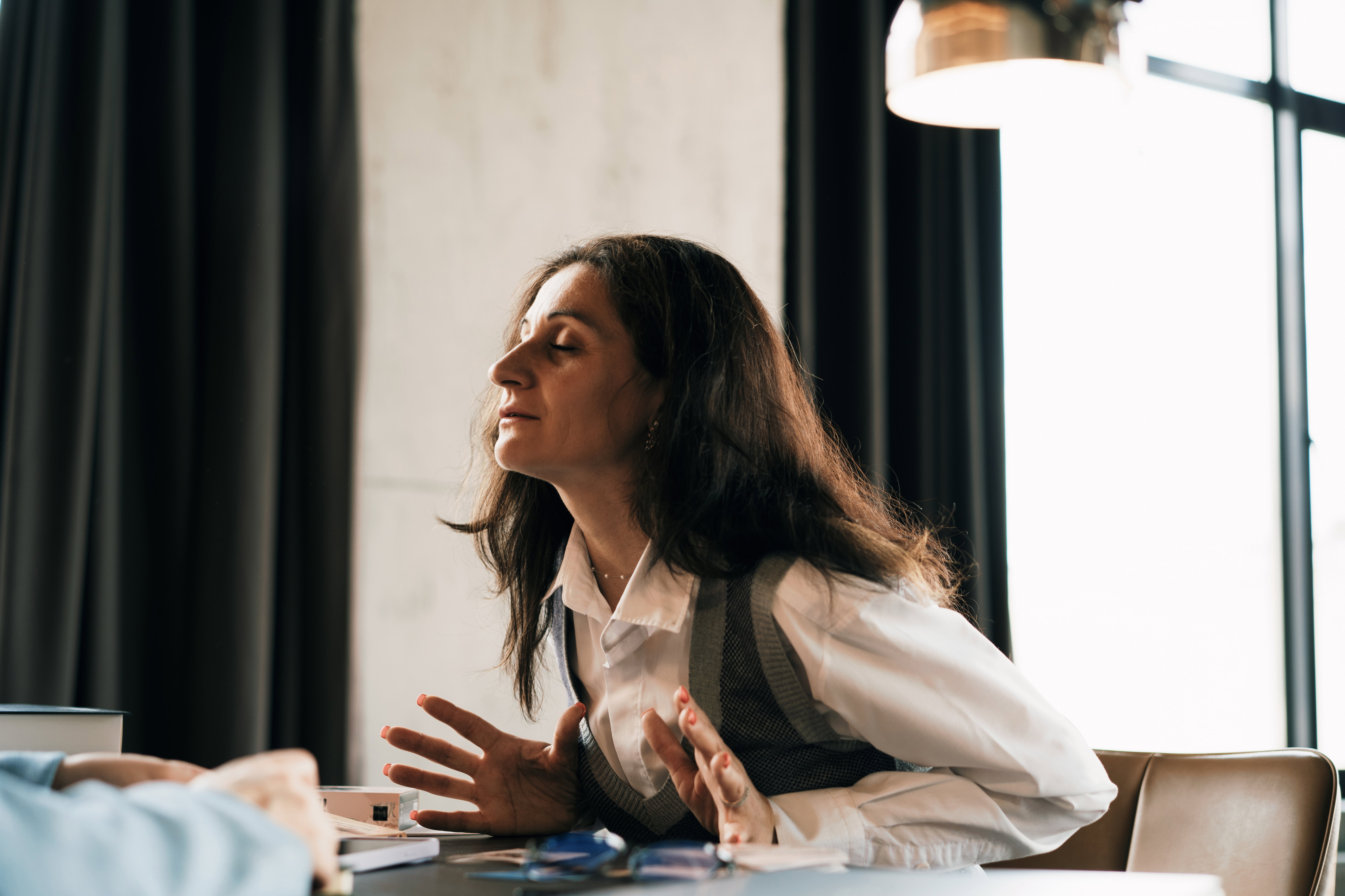 Focused Woman During Business Meeting in a Modern Office Setting