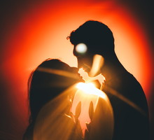 A beautiful young couple in silhouette, enjoying time together