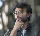 Thoughtful businessman wearing eyeglasses with hand on chin