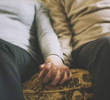 Senior couple holding hands