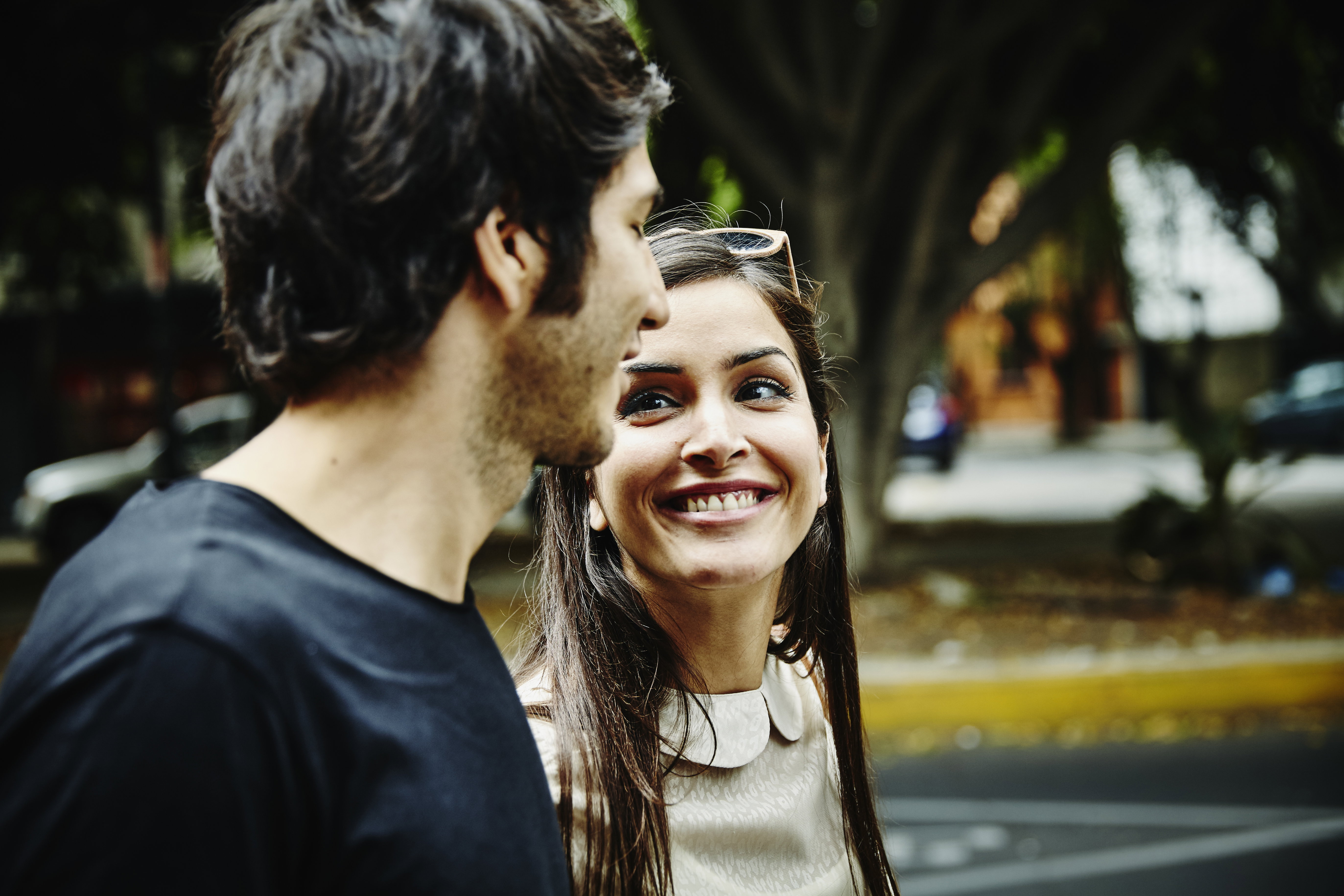 Smiling woman in discussion with boyfriend