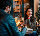 Woman Dining With Partner at Restaurant