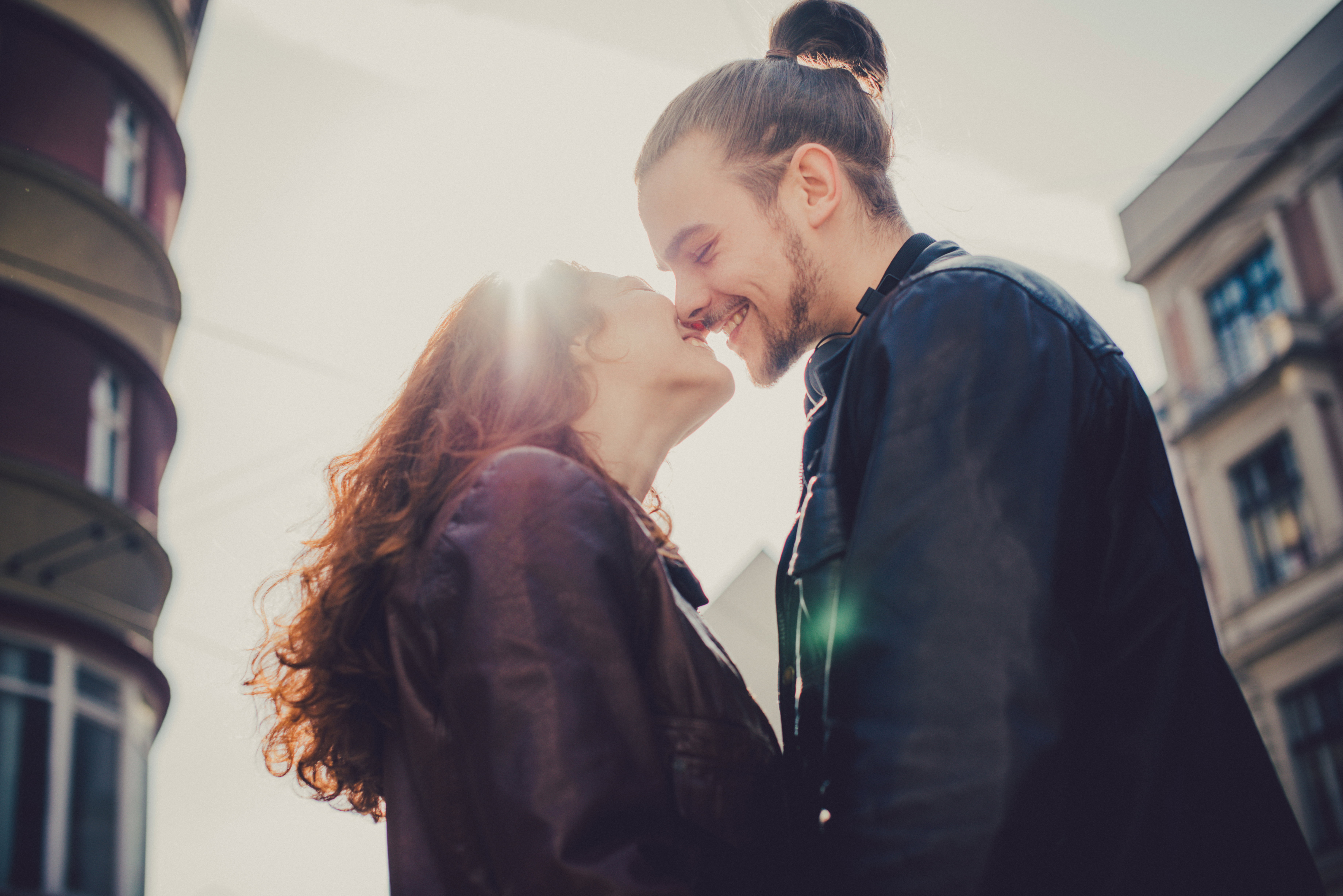 Smiling couple before kissing.