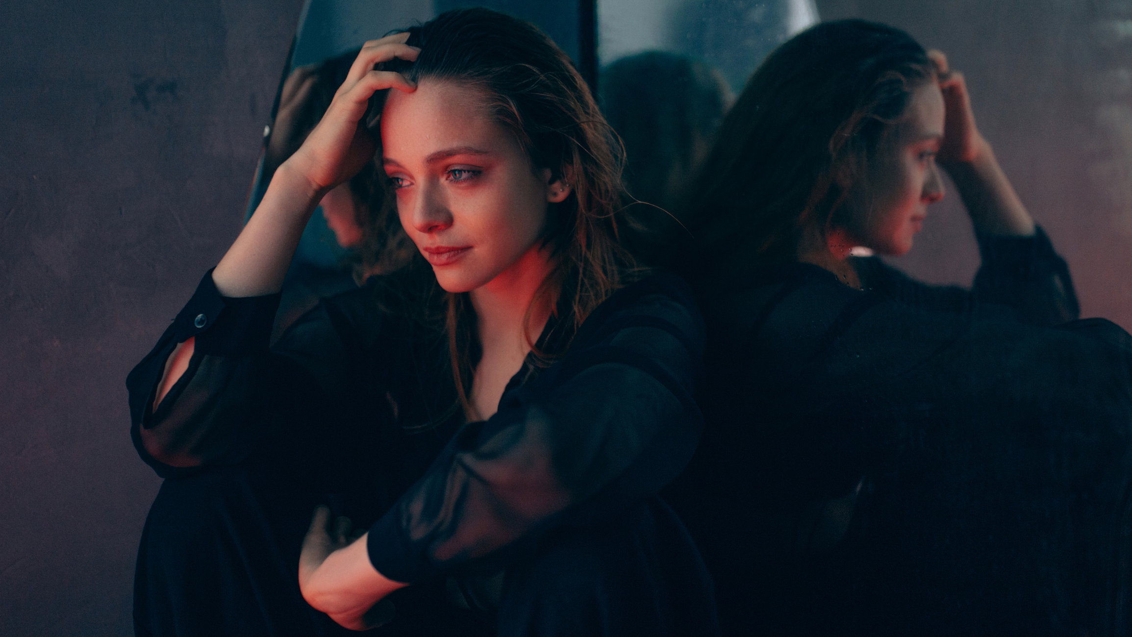 Conceptual portrait of young sad woman