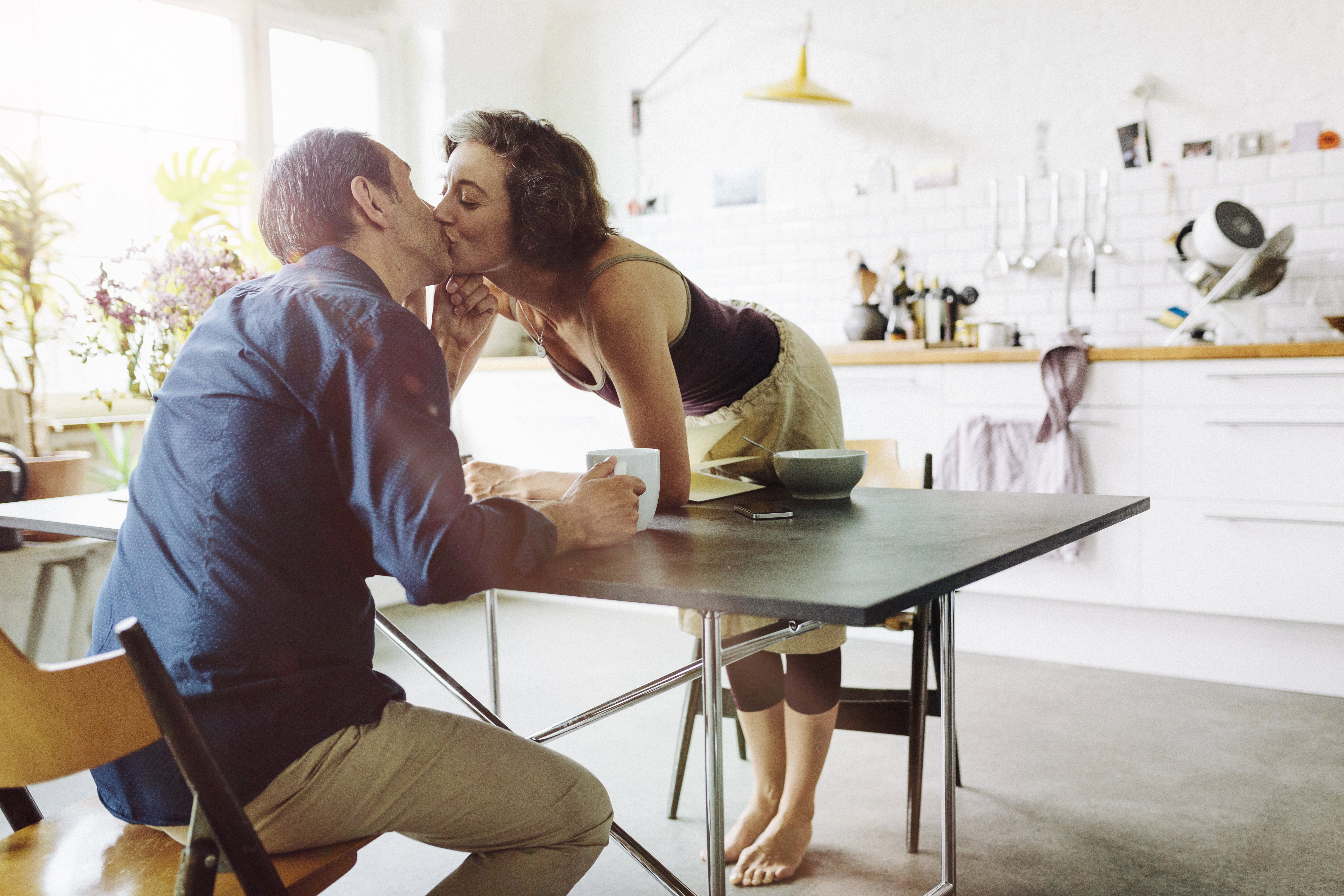 Mature couple kisses