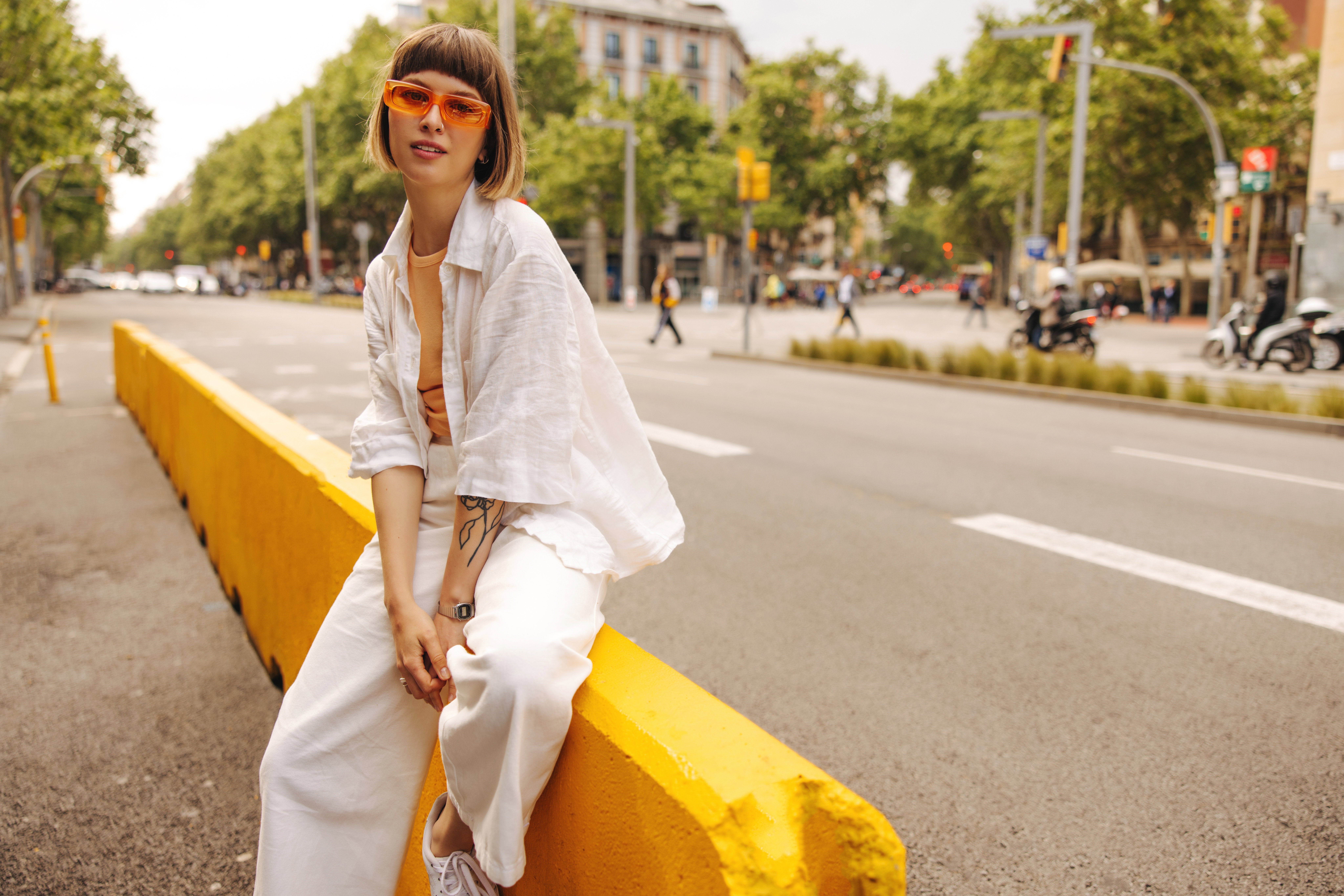 Modern young caucasian girl posing looking at camera outdoors.