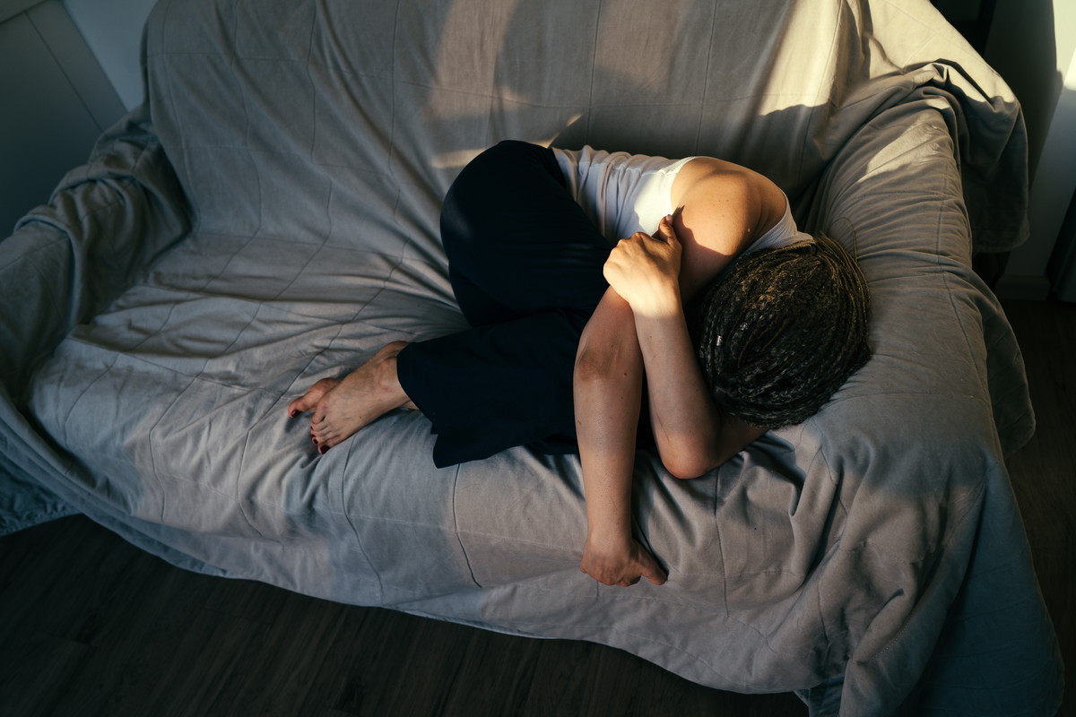 Portrait of a woman lying on the sofa