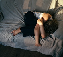 Portrait of a woman lying on the sofa