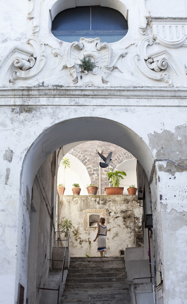 woman climbing a staircase, Ischia, Italy