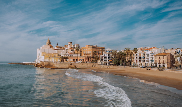 Sand beach and historical Old Town in Mediterranean resort Sitges near Barcelona, Costa Dorada, Catalonia, Spain