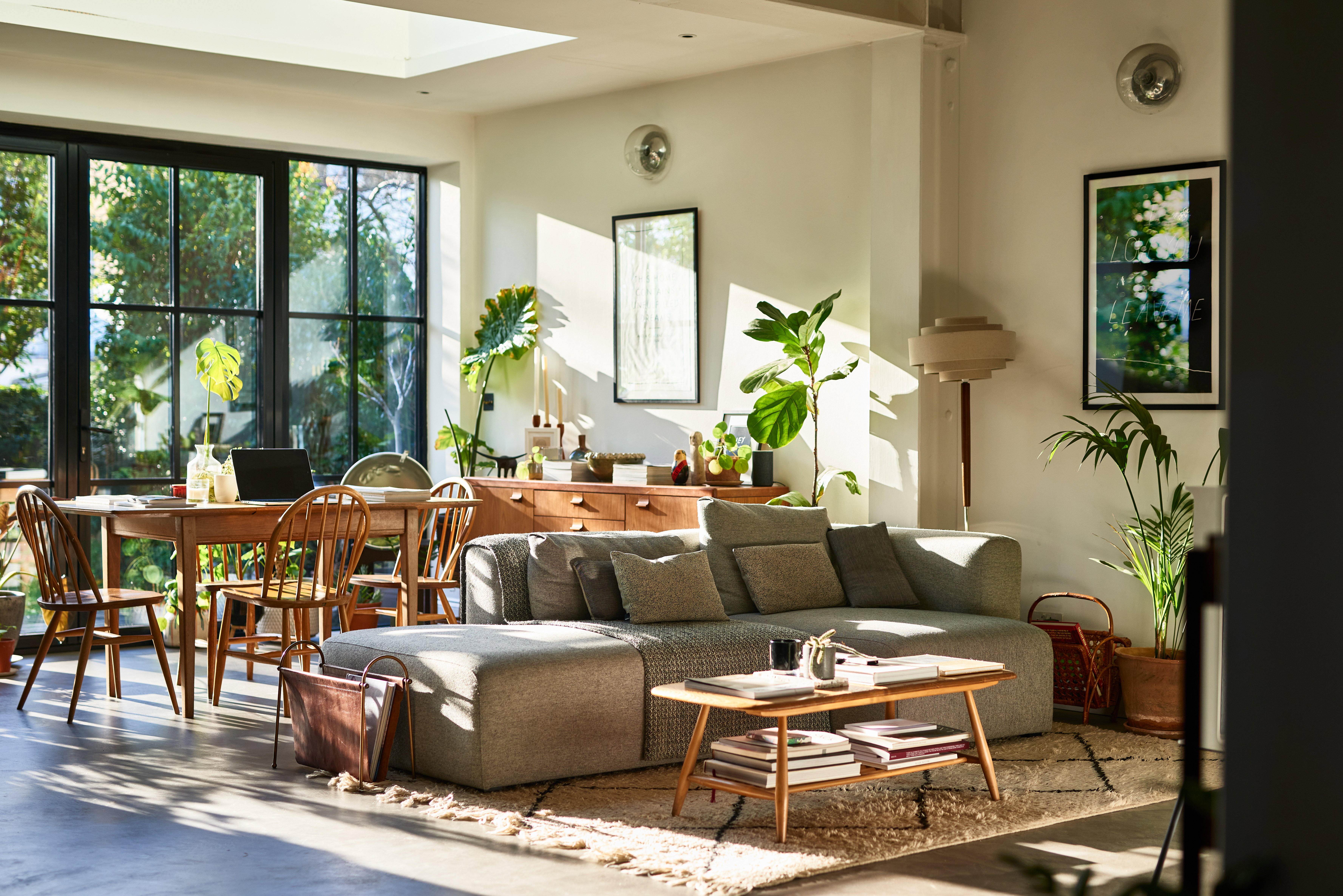 Open plan living space in residential house with natural light and retro furniture
