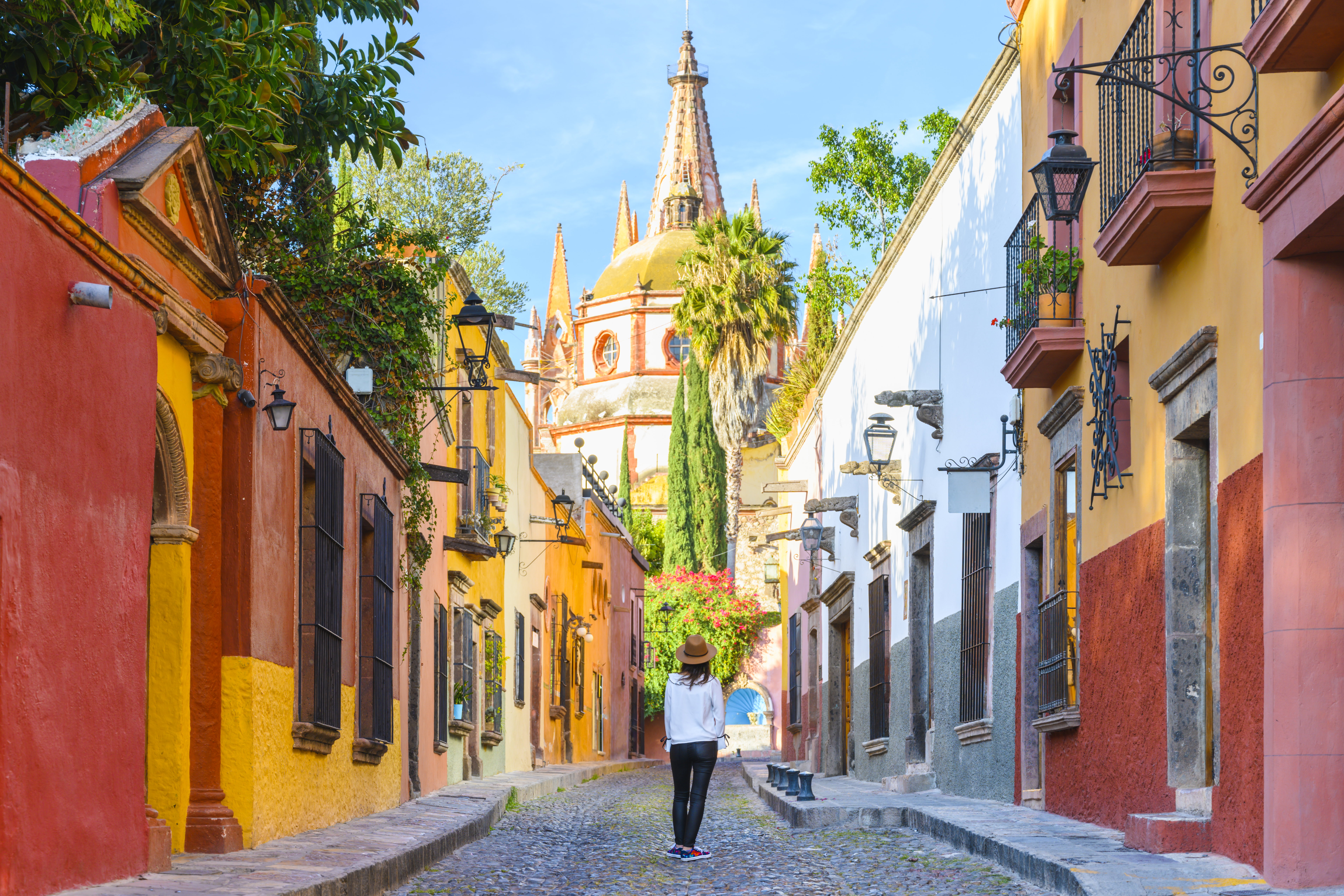 Woman admiring the parish church in San Miguel de Allende, Mexico