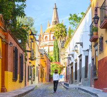 Woman admiring the parish church in San Miguel de Allende, Mexico