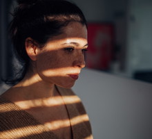 Portrait of young woman in her apartment