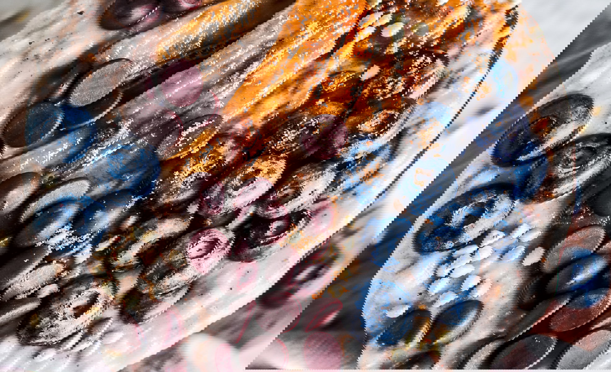 Almond butter buckwheat oatmeal with chocolate chip, blueberries and caramelized bananas