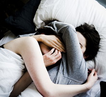 Lesbians sleeping in a bed