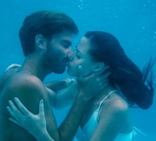 Young couple kissing underwater