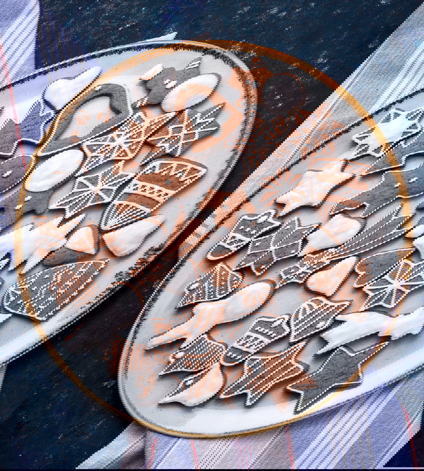 High Angle View Of Gingerbread Cookies In Plate On Marble