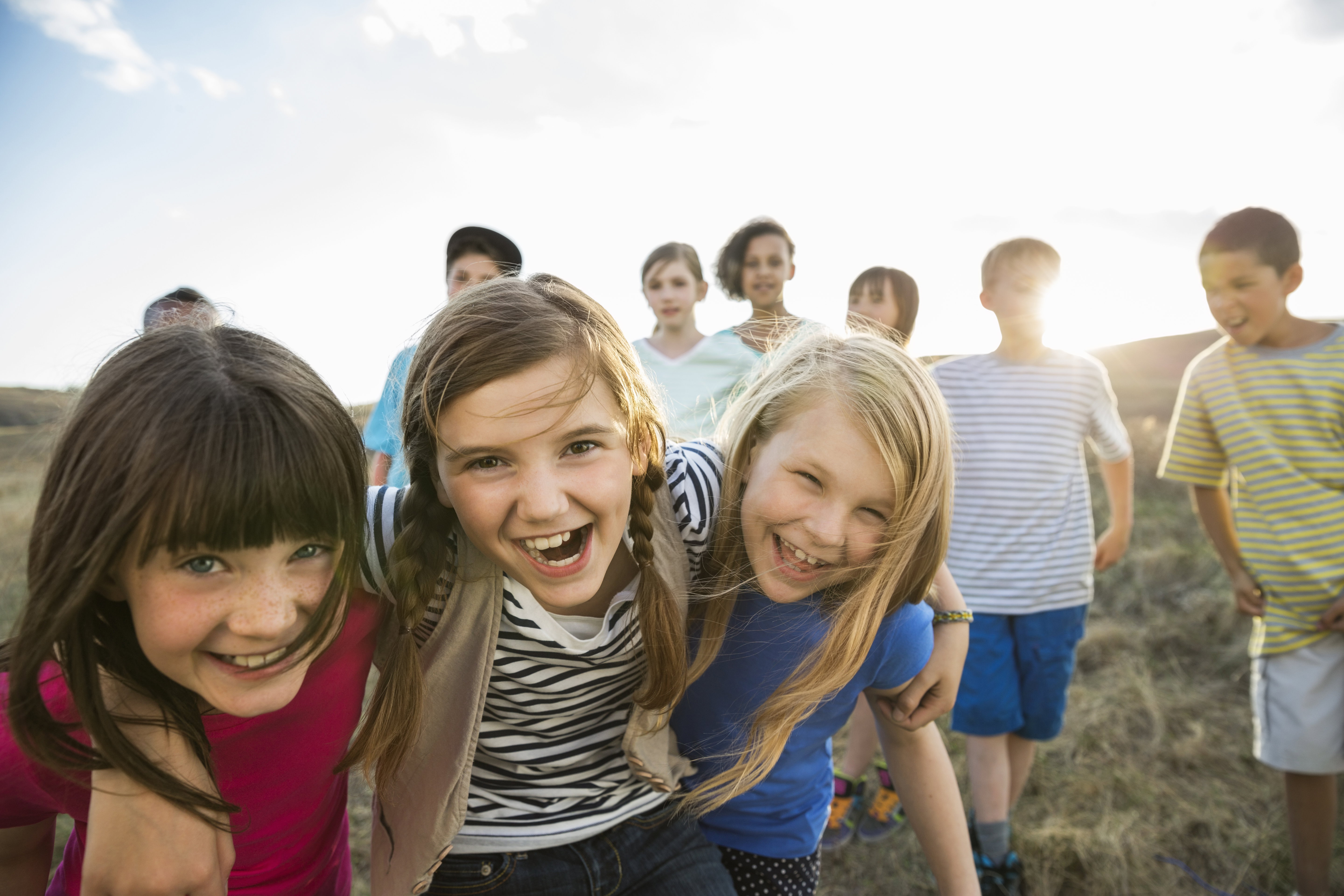 Group portrait of kids having fun outdoors