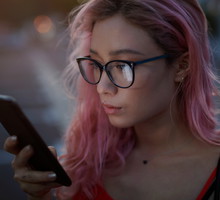 Young woman holding a smart phone