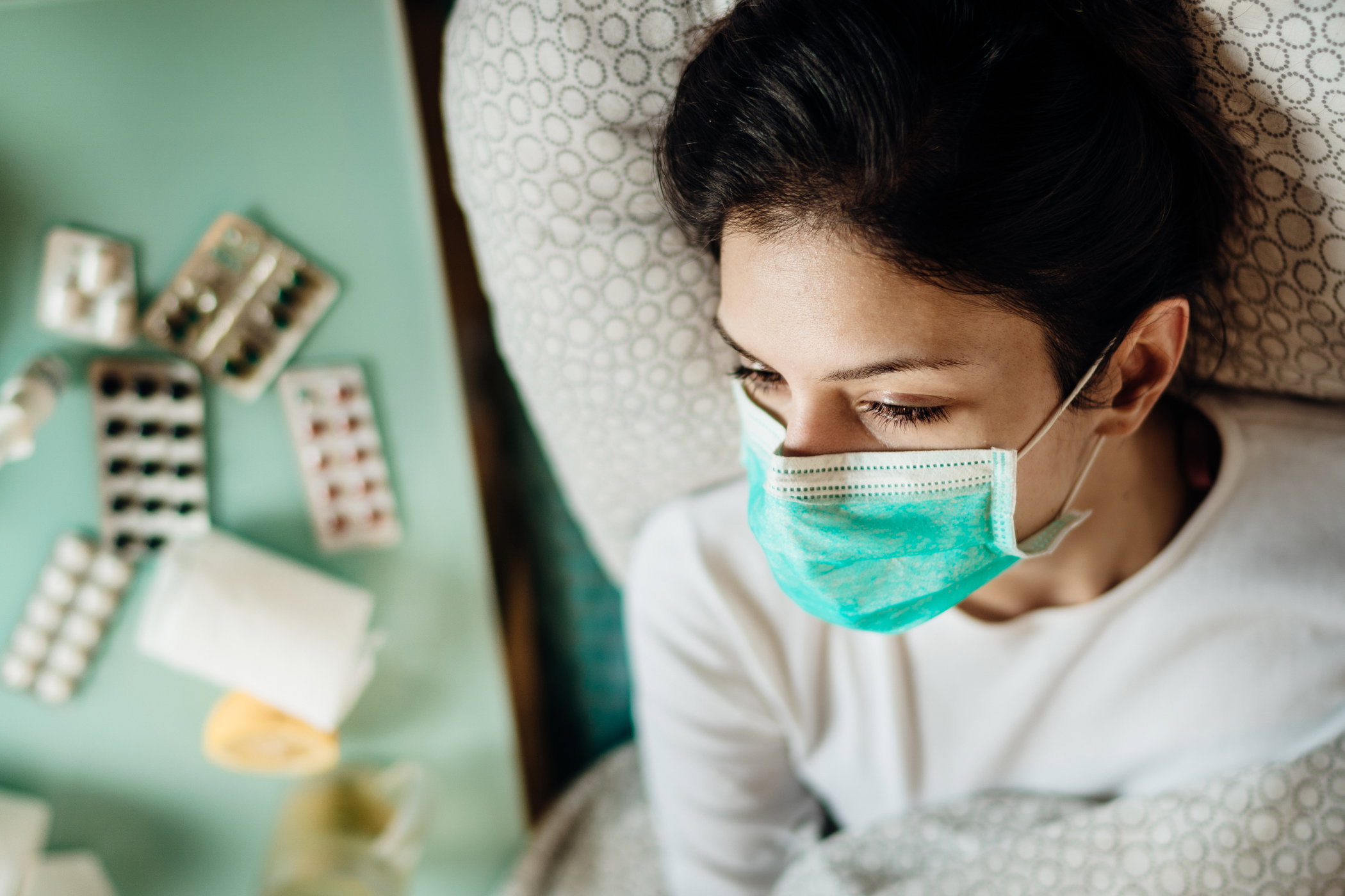 Infected woman with mask in mobile quarantine hospital units isolation.Coronavirus patient having pneumonia disease symptoms.Health care.Attacked immune system.Medical help.Recovery from virus