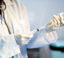 Close-Up Of Doctor Filling Medical Injection.