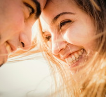 Close up happy couple head to head