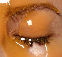 Female models face covered in honey