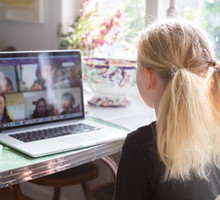 A child talks to her classmates on video conference call