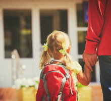 father and little daughter go to school or daycare