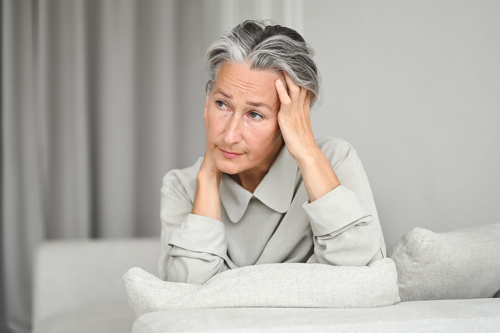 Elegant senior woman feeling tired.
