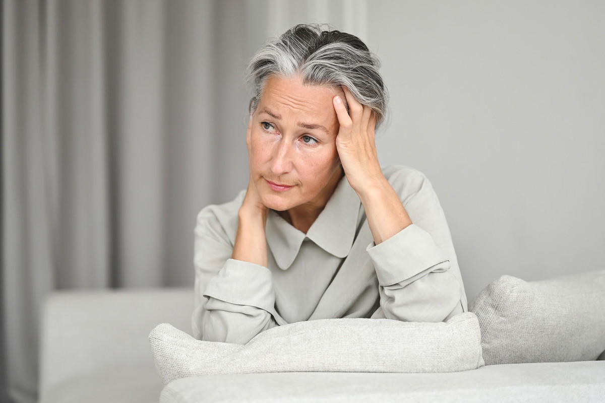 Elegant senior woman feeling tired.