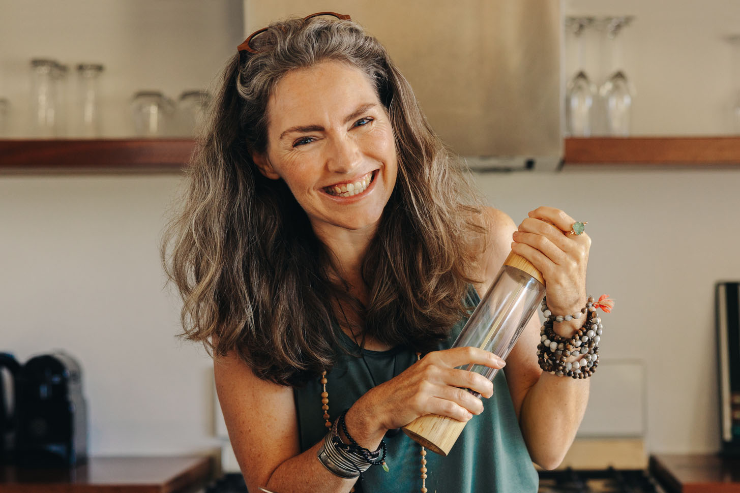 Cheerful senior woman following a healthy vegan recipe at home
