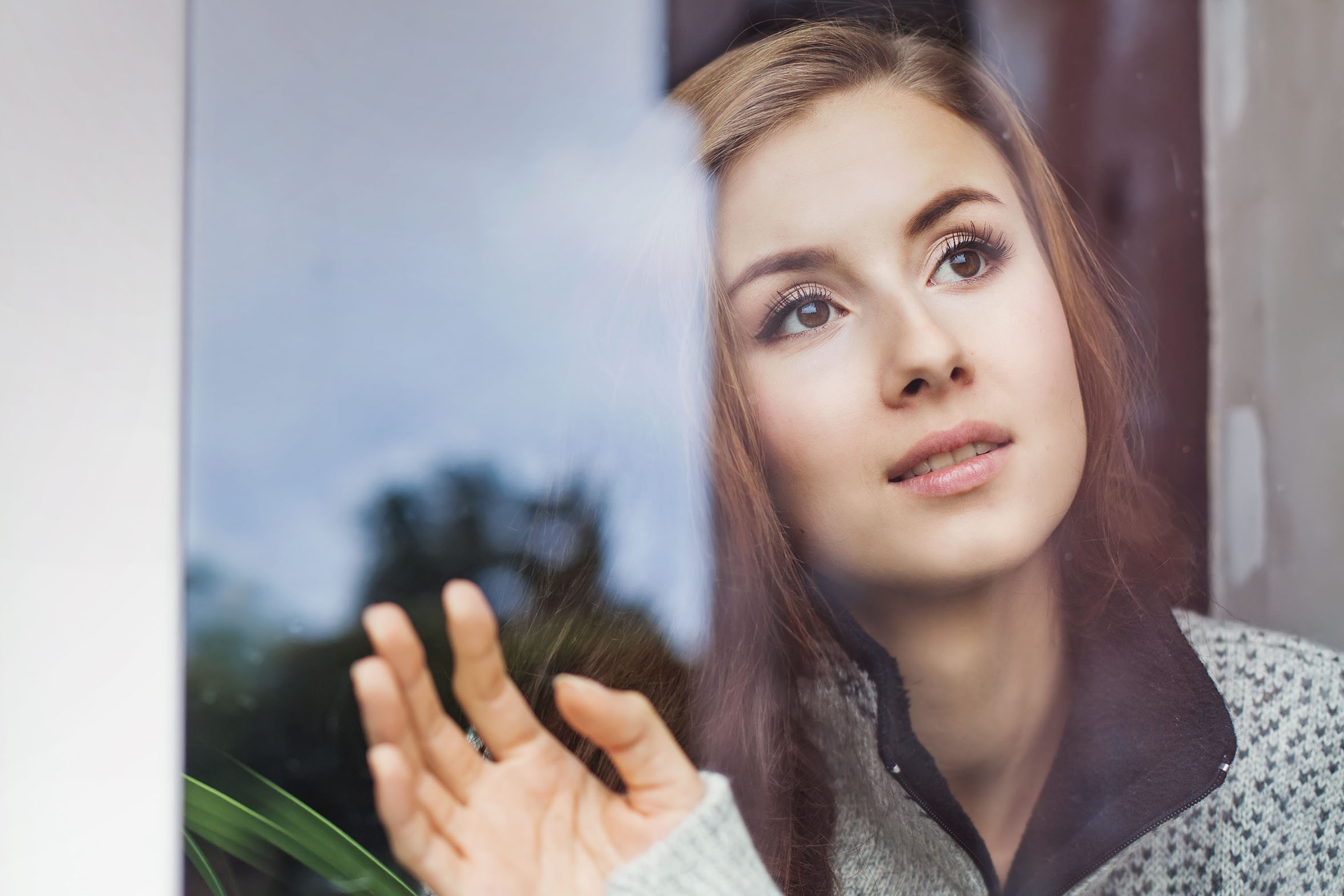 Beautiful young woman on a balcony