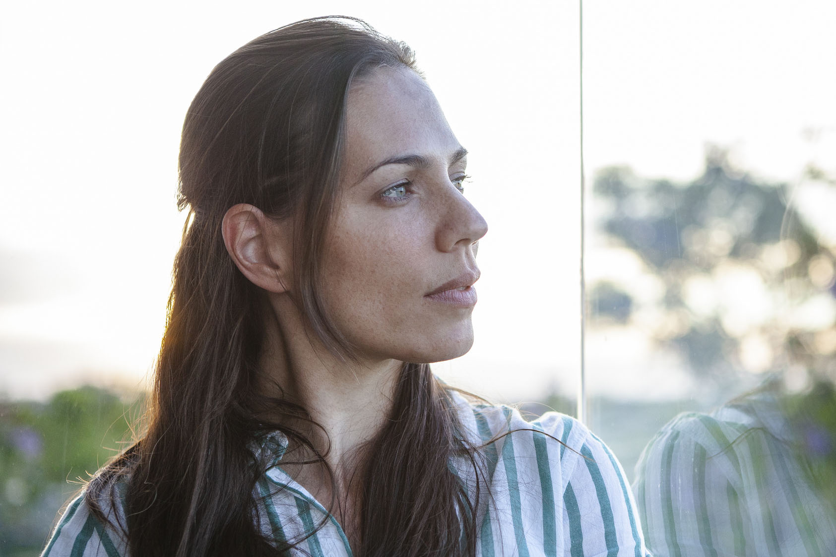 Portrait of beautiful woman with sunset light