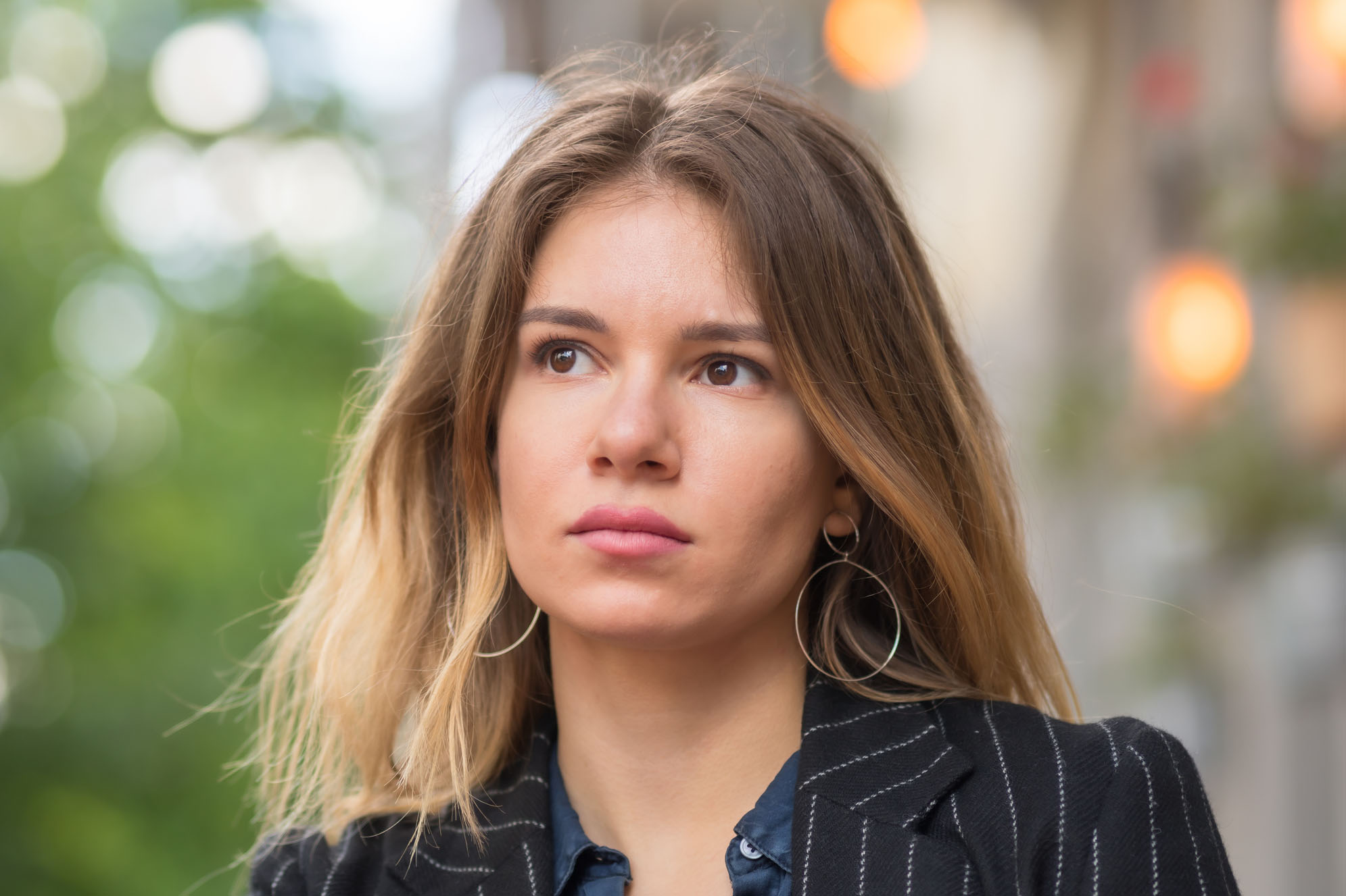 Portrait of woman looking thoughtful or daydreaming