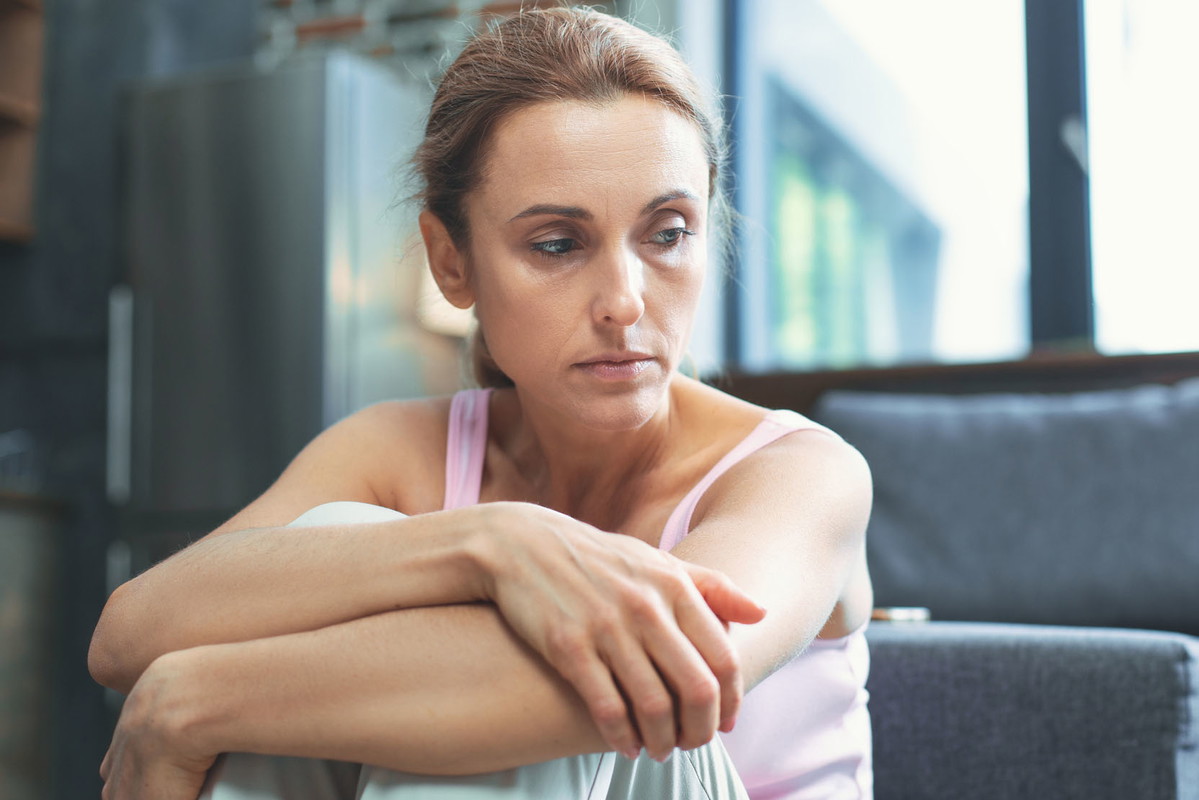 Pleasant mature woman acting hopeless