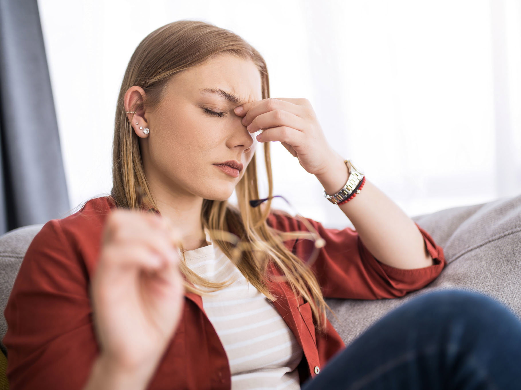 Young woman having a headache.