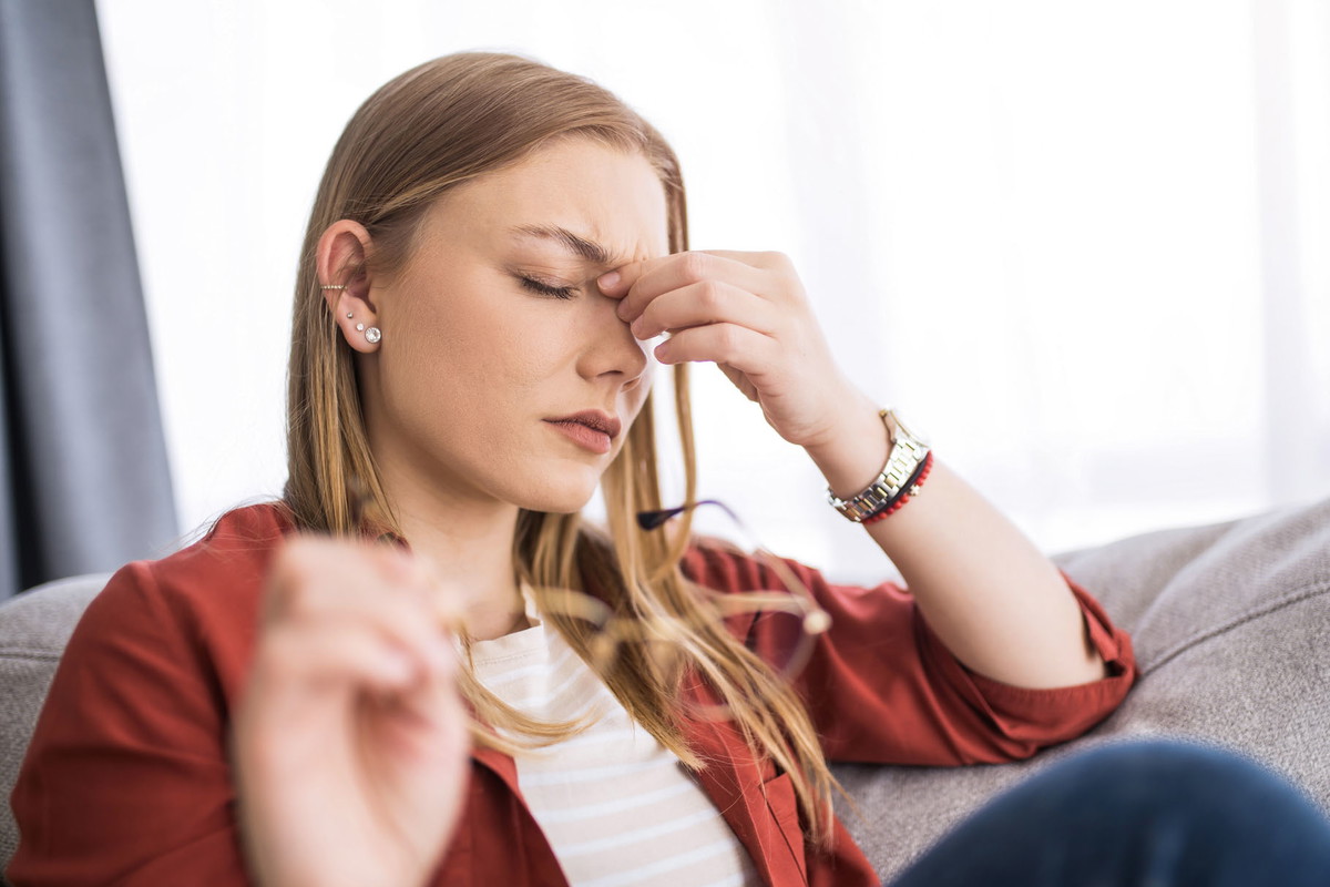 Young woman having a headache.