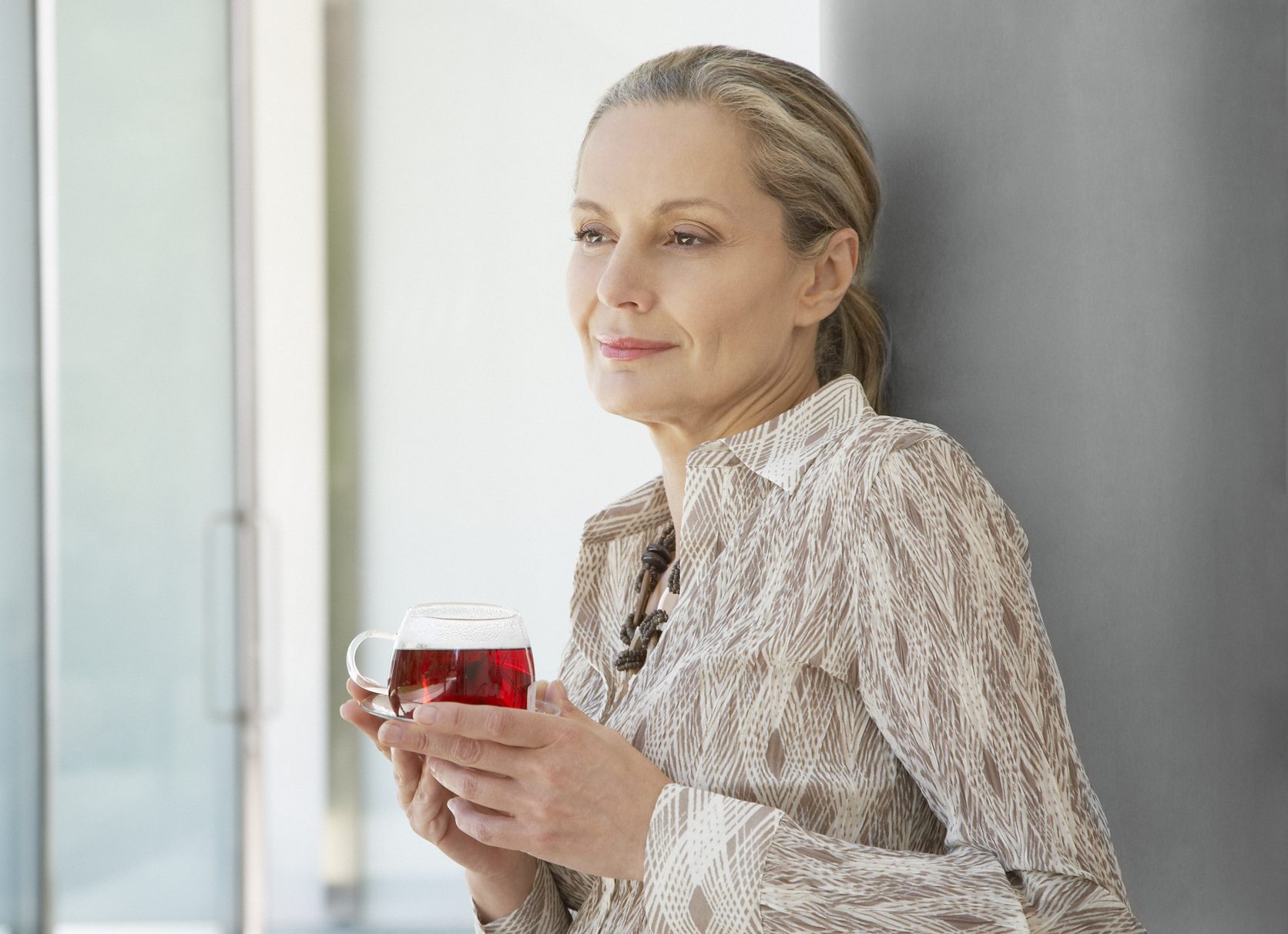 Woman relaxing outdoors with a cup of tea