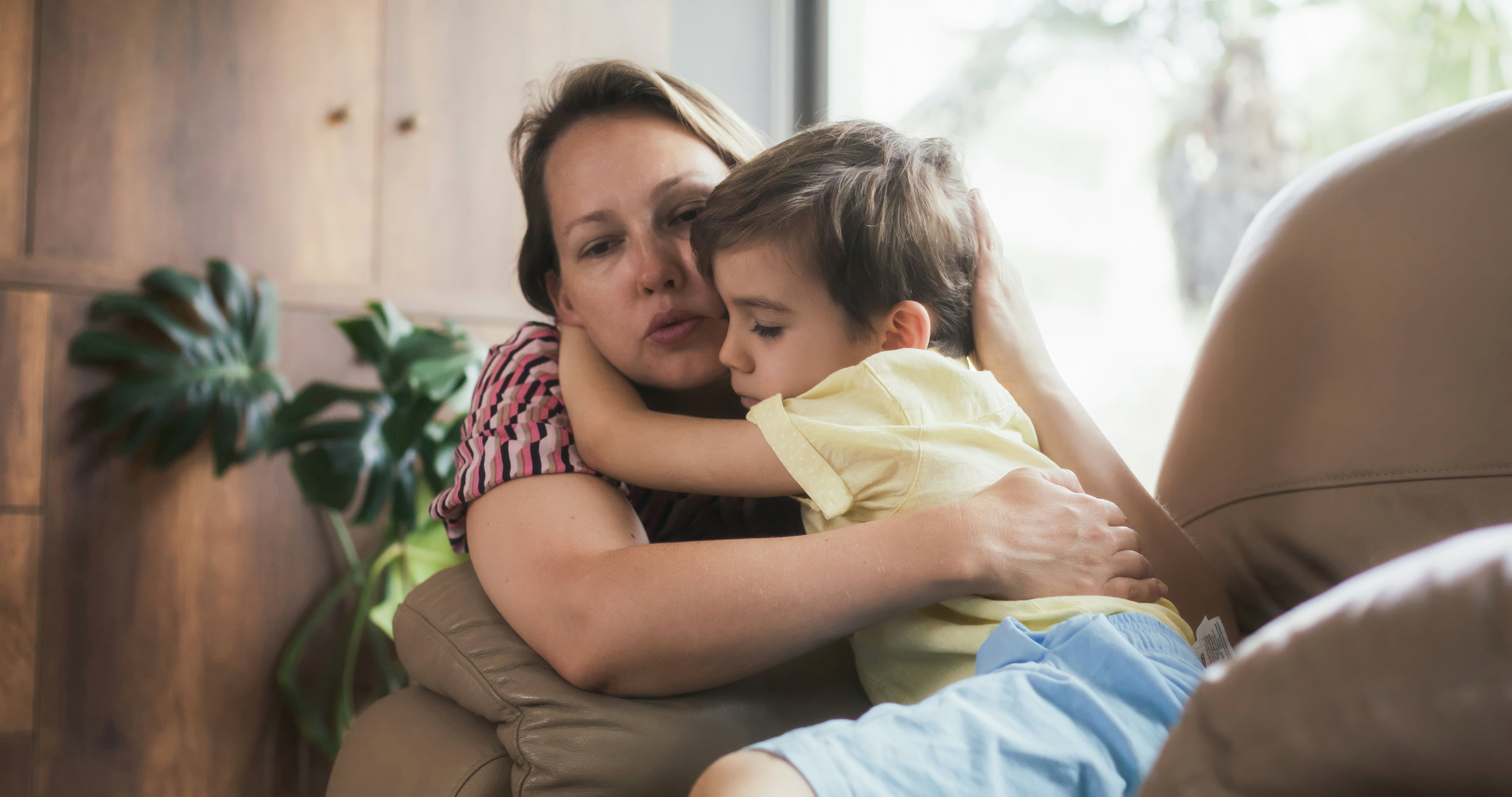 Mother consoling her son