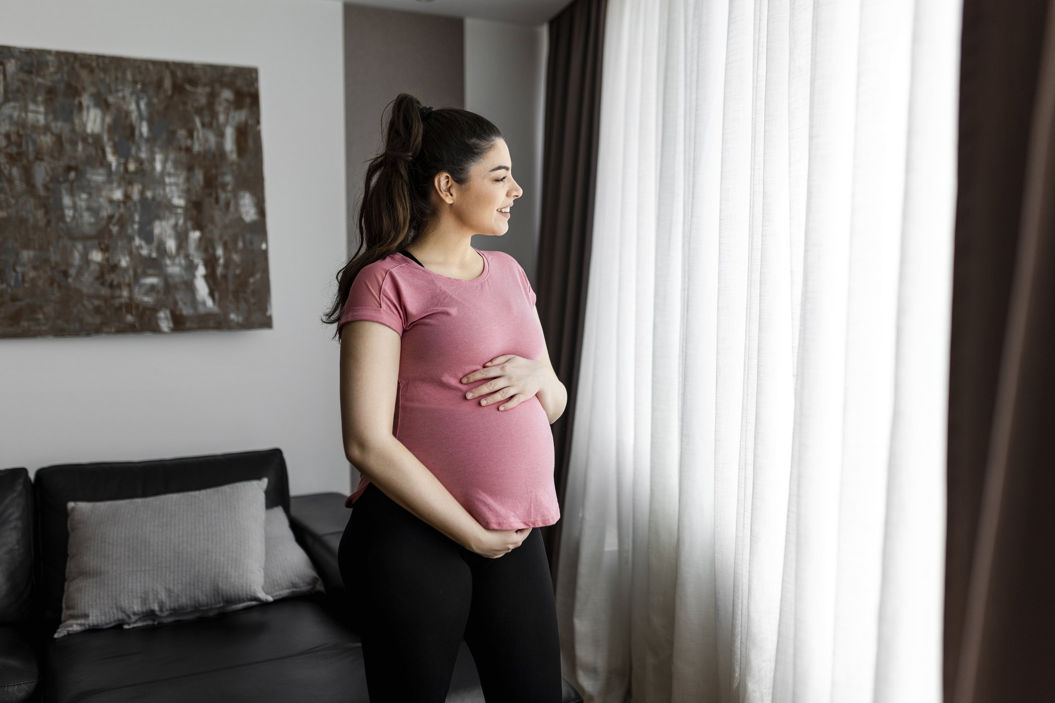 Healthy pregnancy. Side view pregnant woman with big belly advanced pregnancy. Elegant mother waiting baby