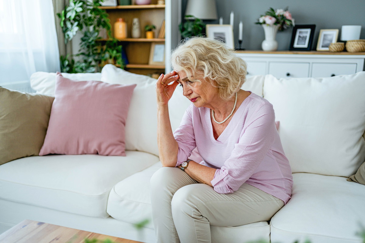 Senior woman suffering from headache