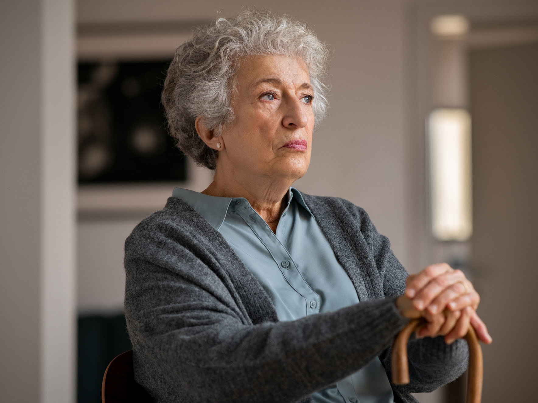 Lonely old woman at home