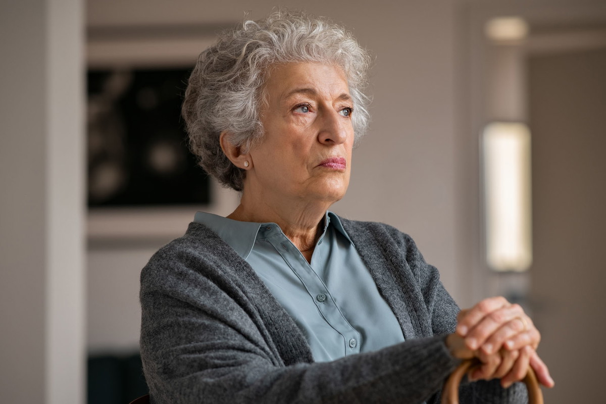 Lonely old woman at home