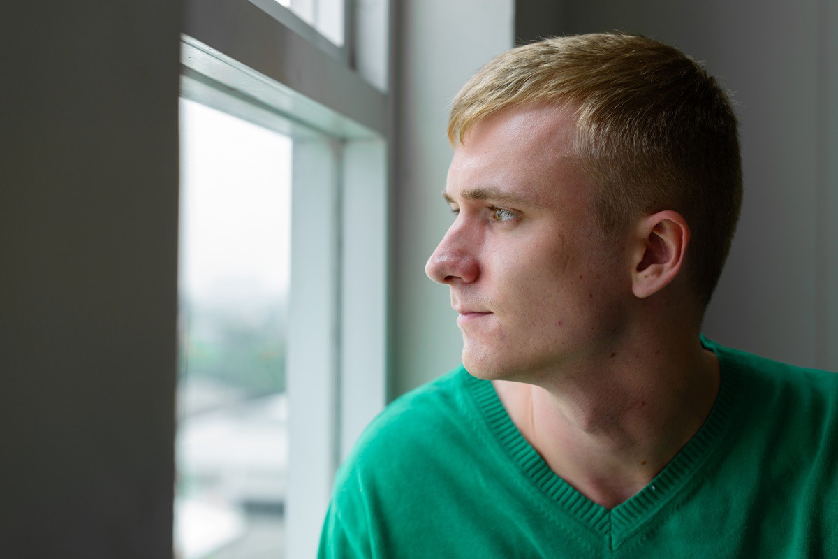 Man looking out of the window