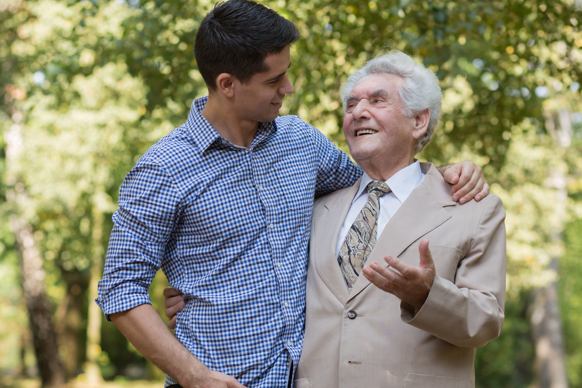 Rich elderly male and carer
