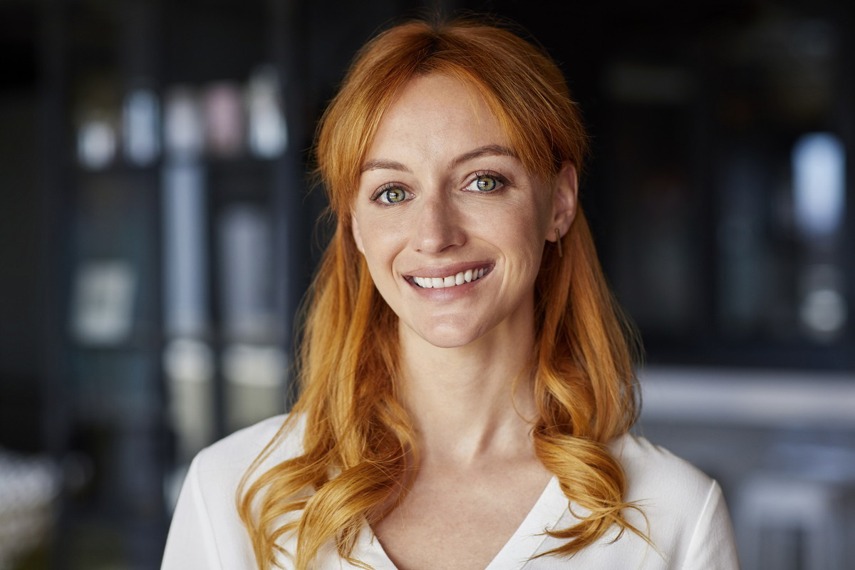 Portrait of young professional smiling in office