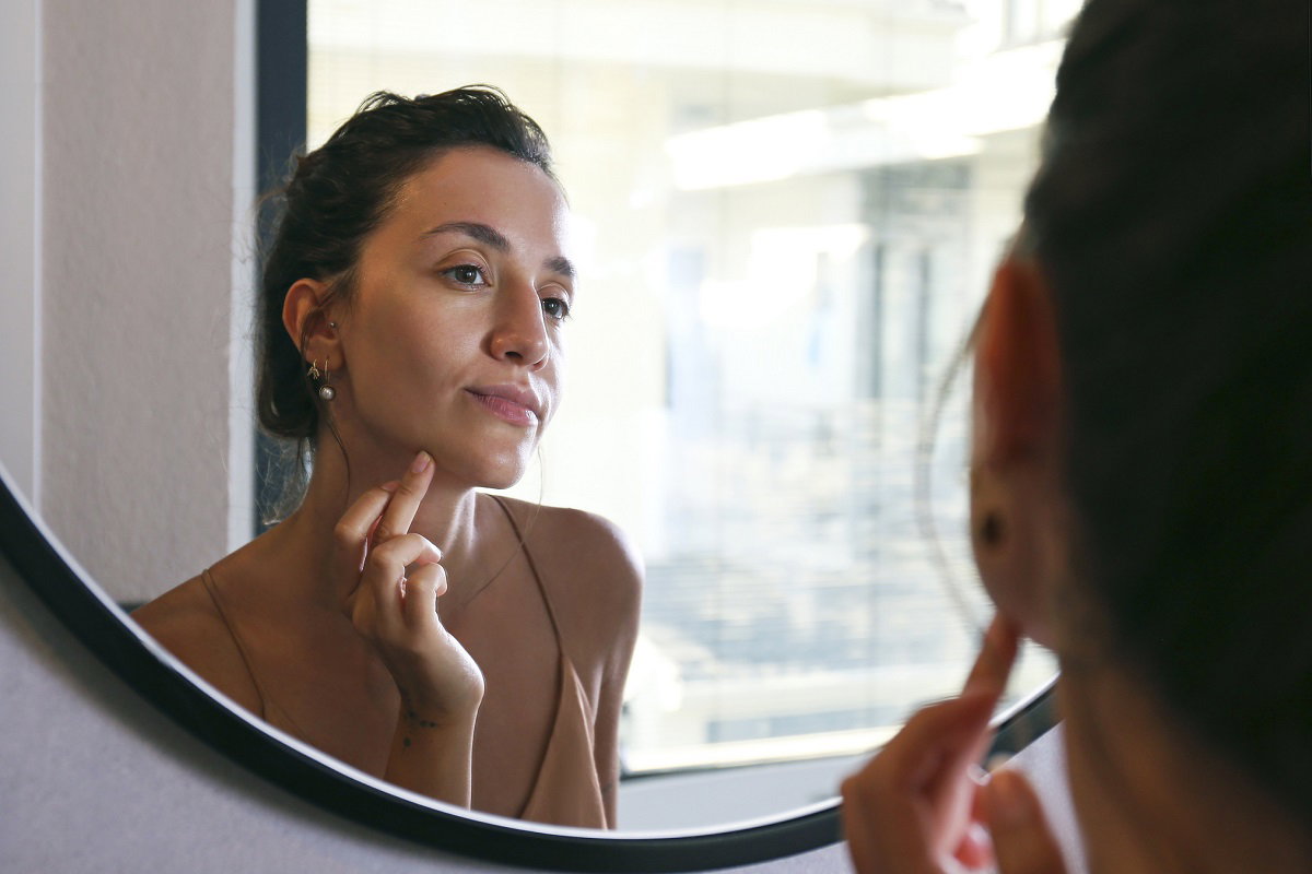 Young woman doing anti ageing facial procedures in the morning